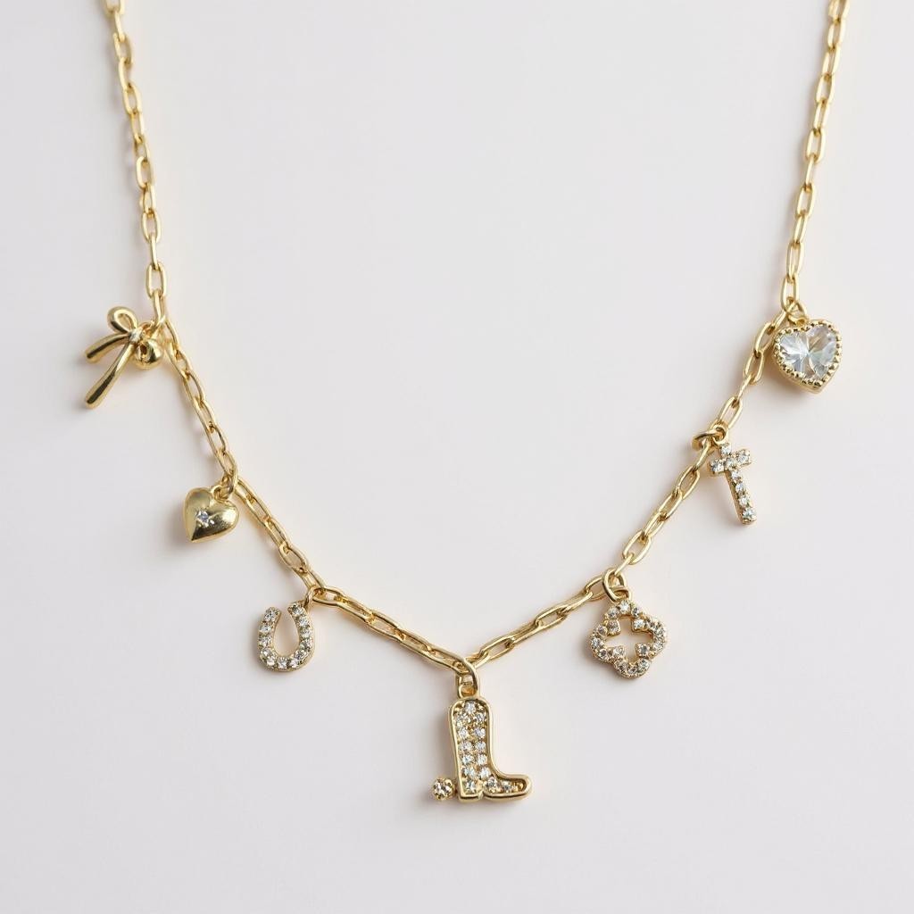 Dainty Small Sparkly Charms Station Necklace. Charms are placed on tiny paperclip chain, charms include: Ribbon, Micro Heart, Horseshoe, Boots, Clover, Cross and Crystal Heart