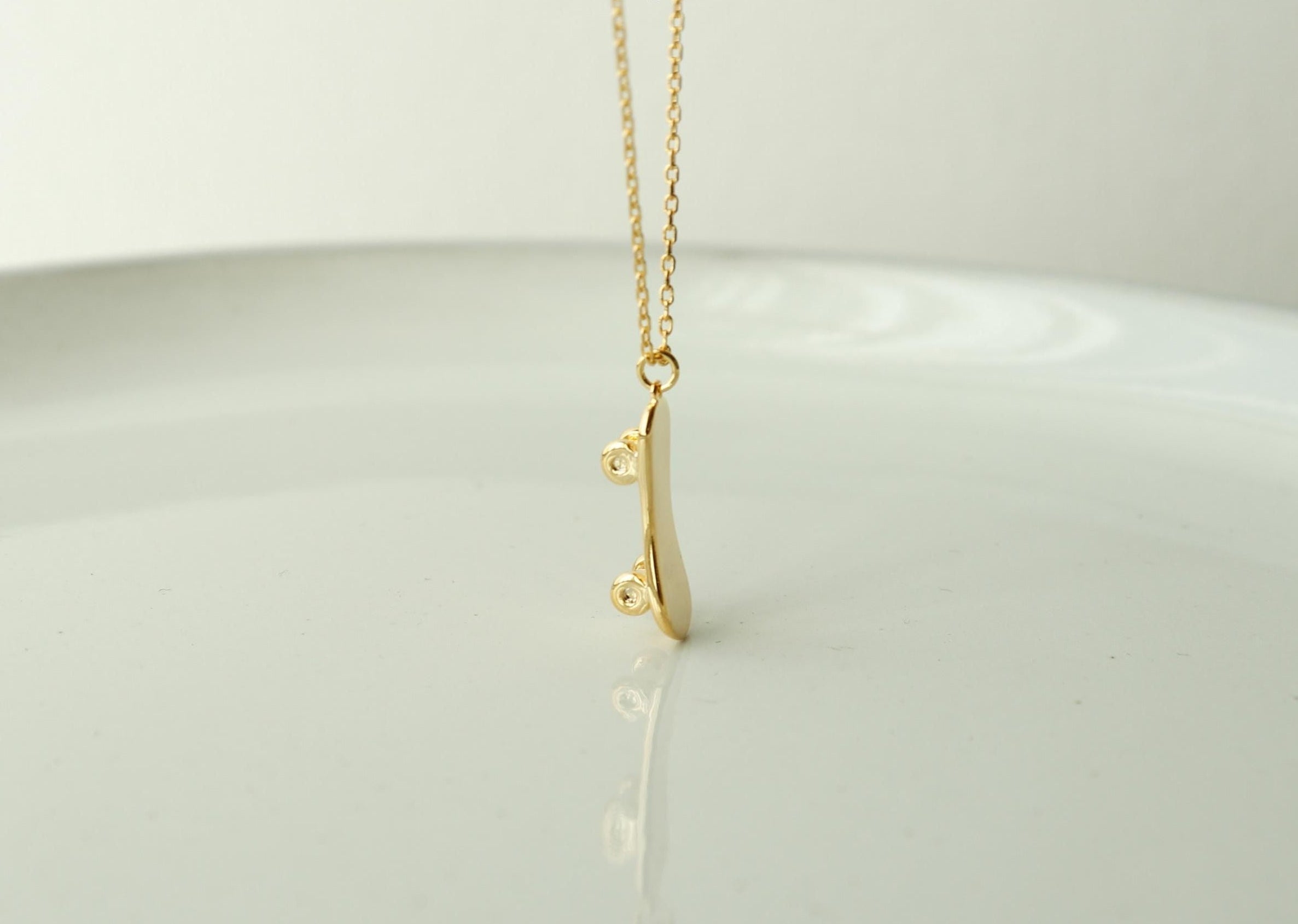 emma's gems dainty skateboard necklace