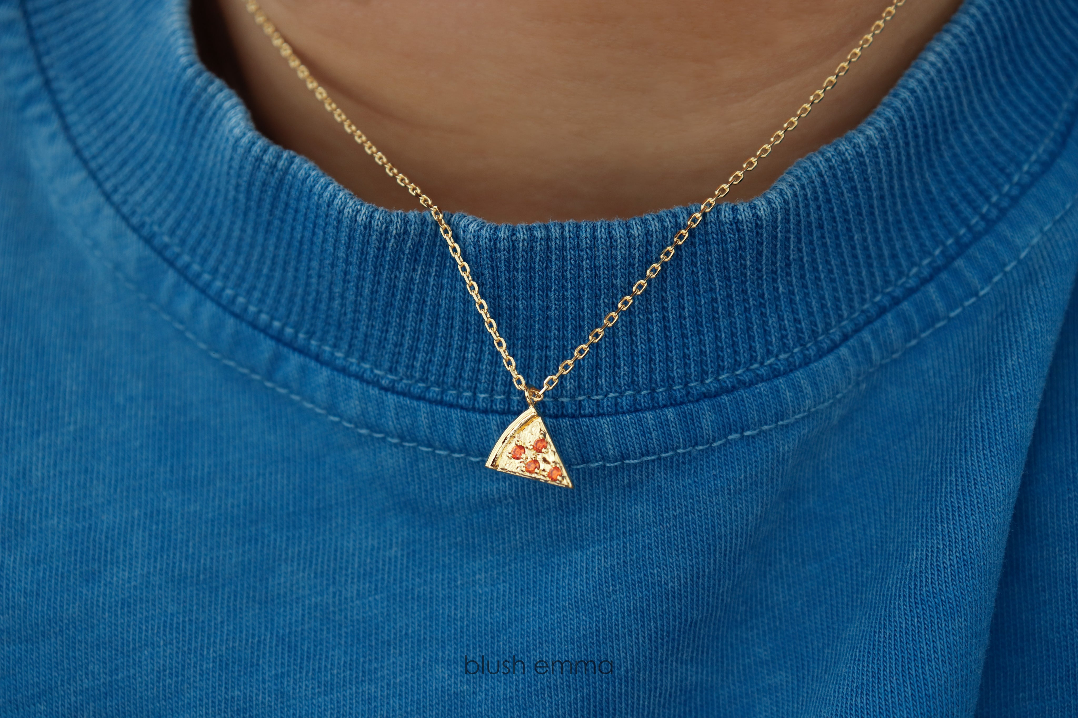 Dainty Red Cubic Pepperoni Pizza Pendant Necklace. Cute Pizza slice for layering, perfect foodie gift. Gold necklace with a pizza-shaped pendant on a light background