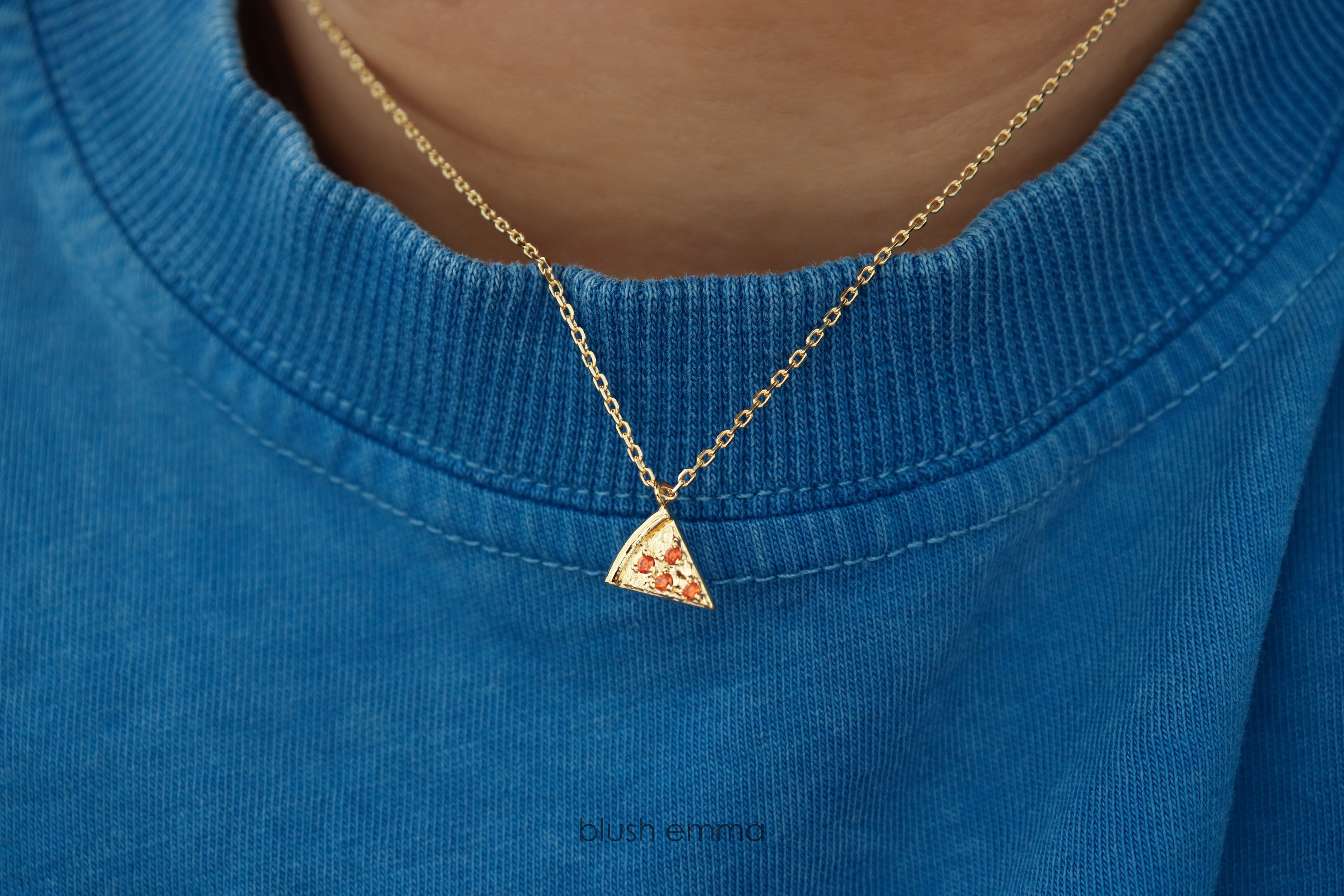Dainty Red Cubic Pepperoni Pizza Pendant Necklace. Cute Pizza slice for layering, perfect foodie gift. Gold necklace with a pizza-shaped pendant on a light background