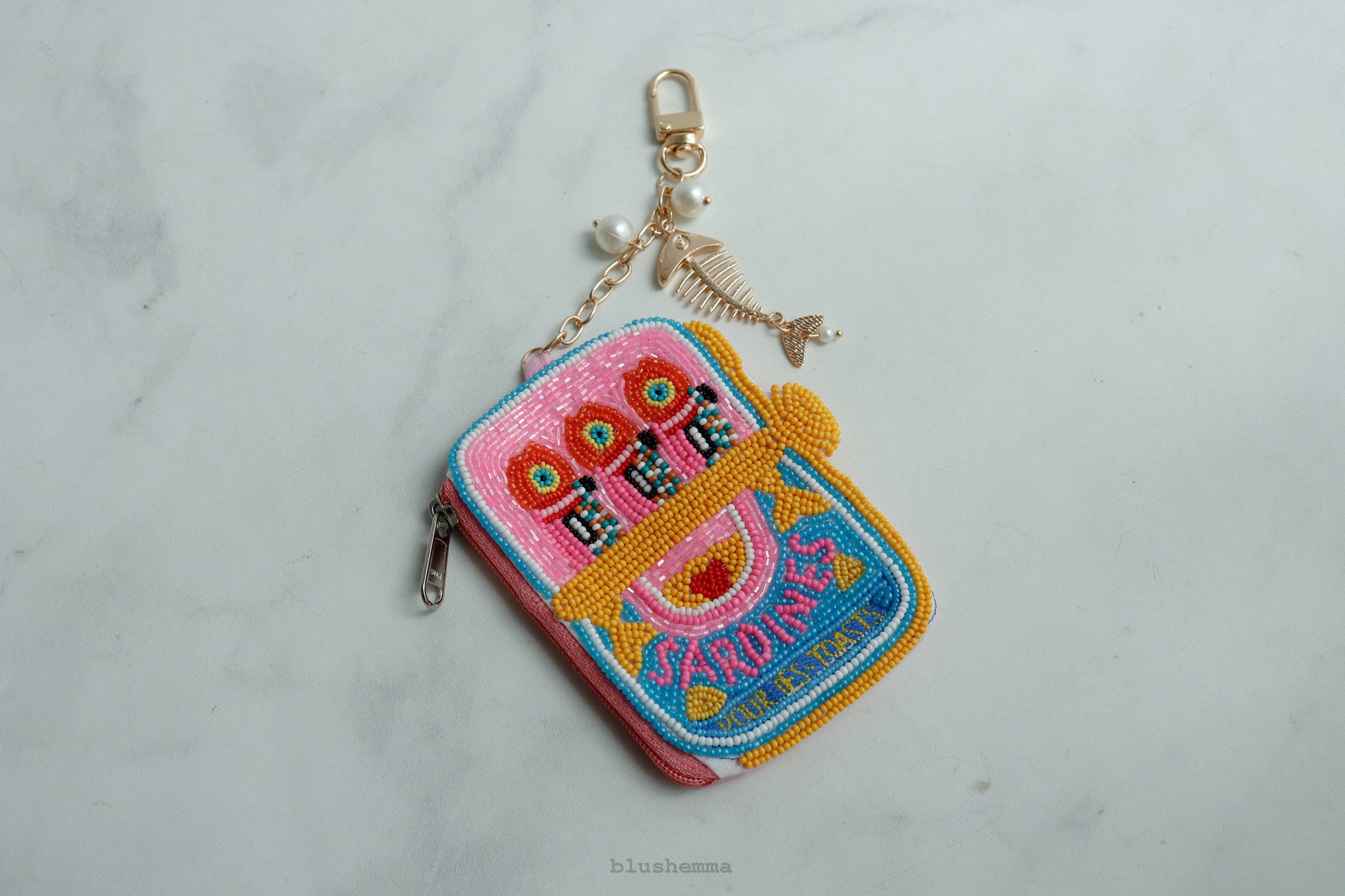 Mini Beaded Sardine Pouch Keychain, Colorful, embroidered Coinbag on a light gray background