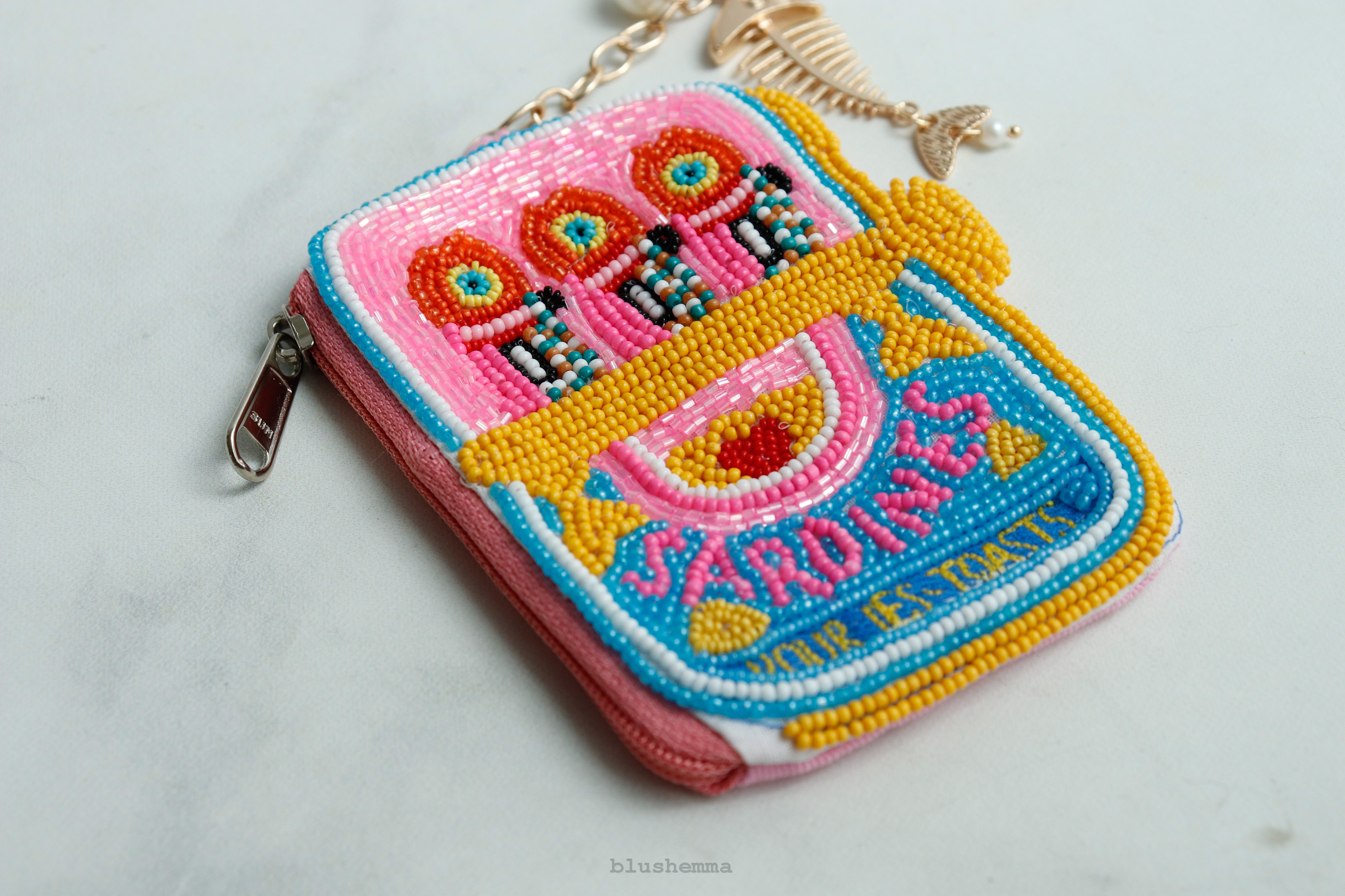 Mini Beaded Sardine Pouch Keychain, Colorful, embroidered Coinbag on a light gray background