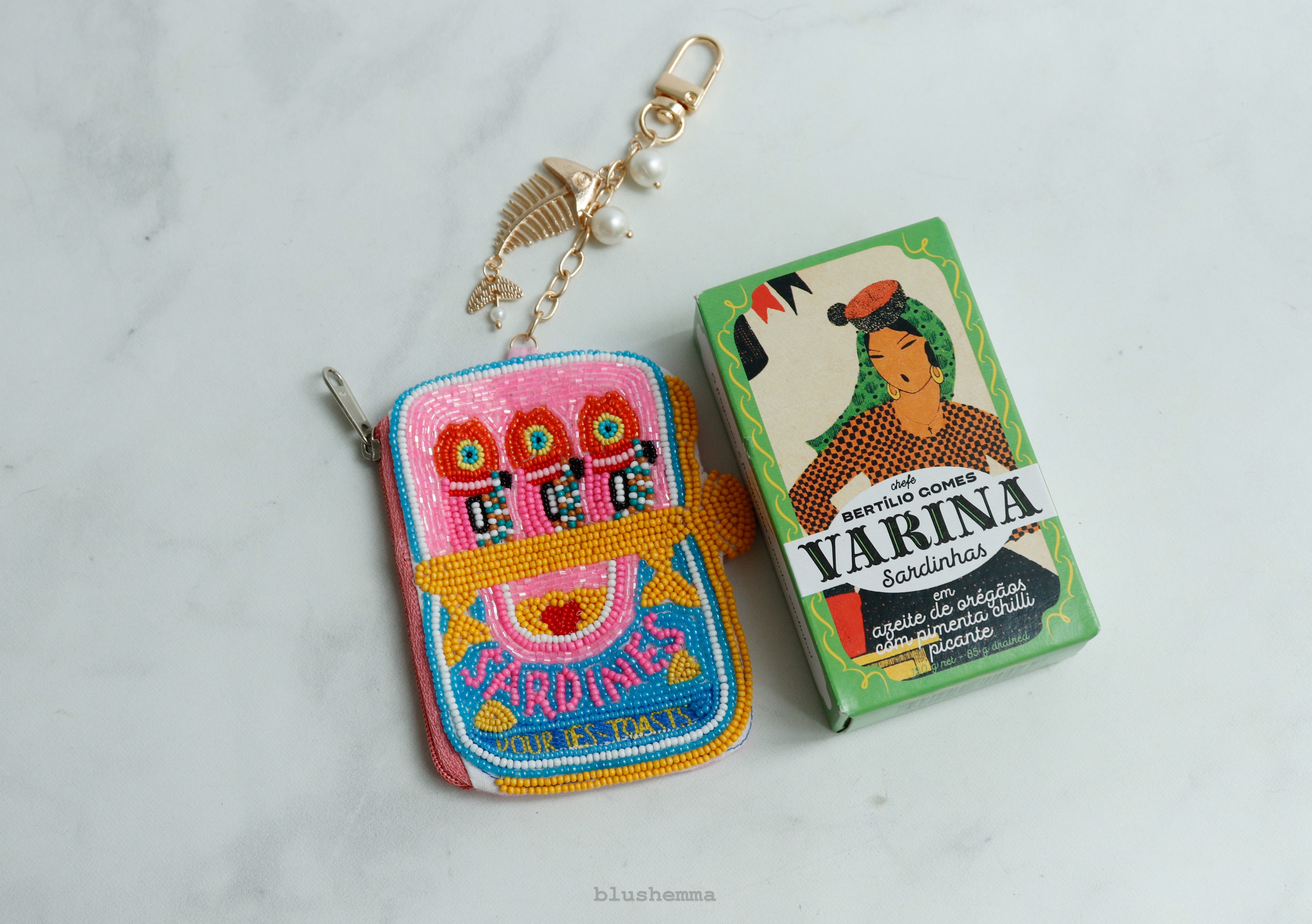 Mini Beaded Sardine Pouch Keychain, Colorful, embroidered Coinbag on a light gray background