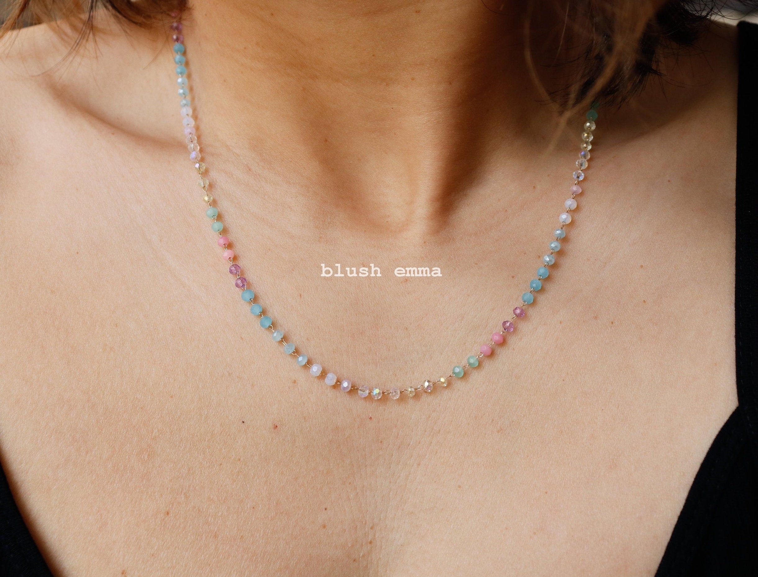 pastel Necklace with multicolored beads on a person's neck, brand 'blush emma' visible.