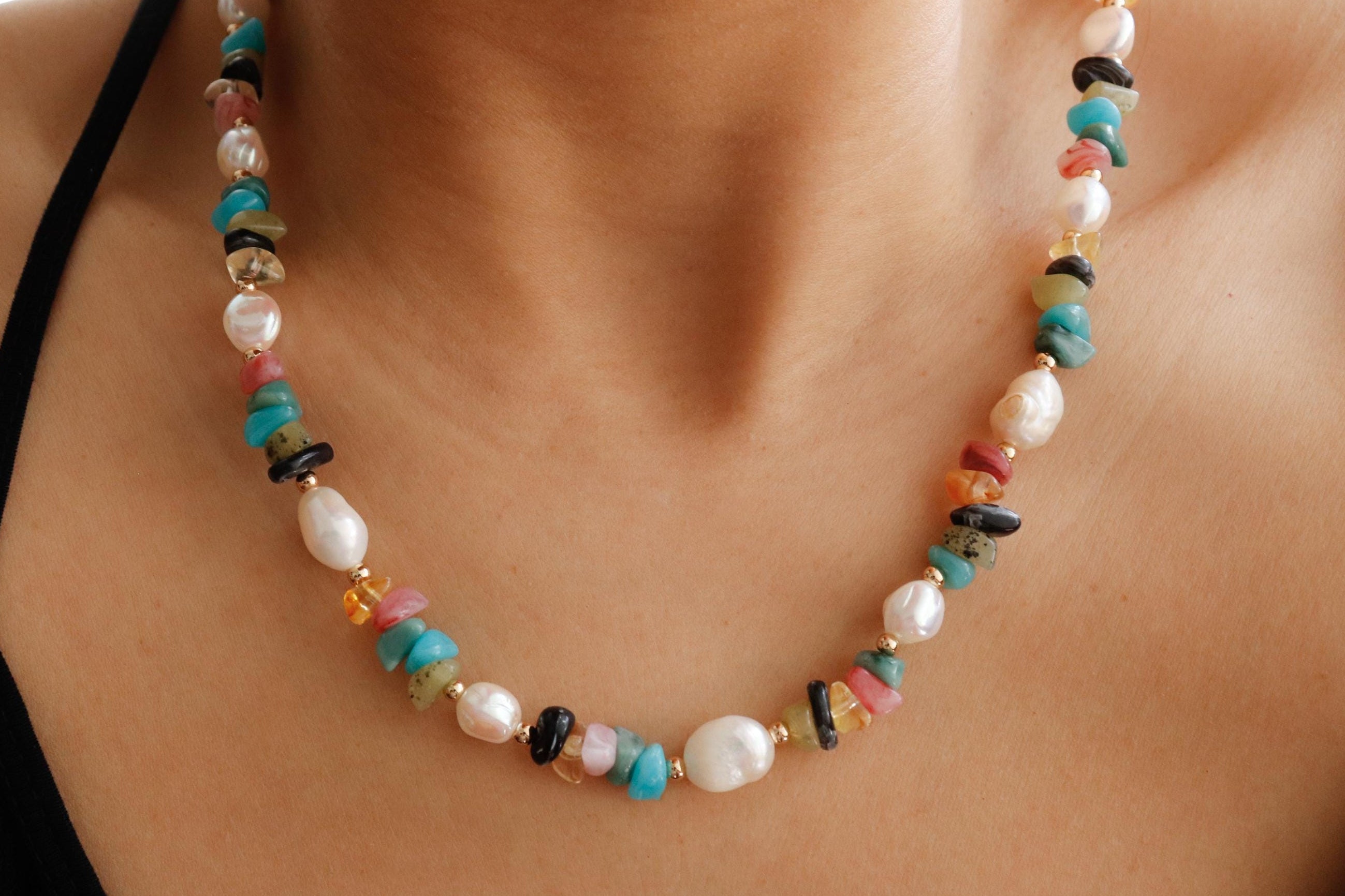 Colorful beaded necklace worn by a person